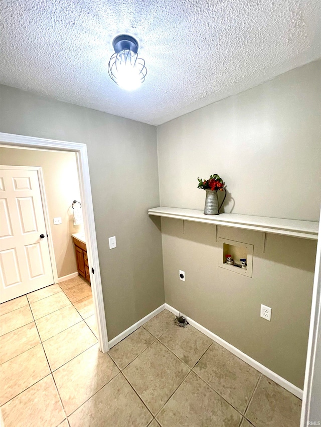 laundry area with washer hookup, a textured ceiling, and electric dryer hookup