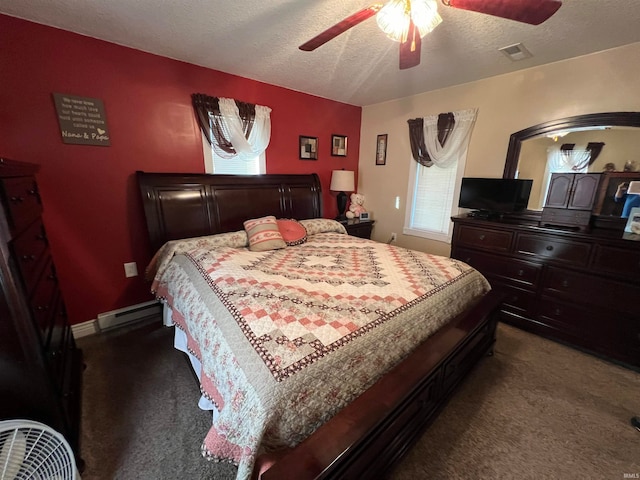 bedroom with carpet floors, a textured ceiling, and ceiling fan