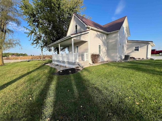 view of property exterior featuring a lawn and cooling unit