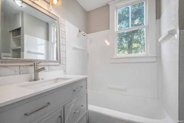 bathroom with vanity and  shower combination