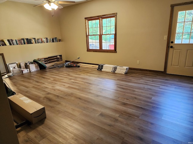 interior space featuring wood-type flooring and ceiling fan