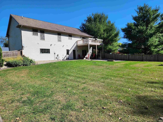 rear view of house featuring a lawn and a patio area