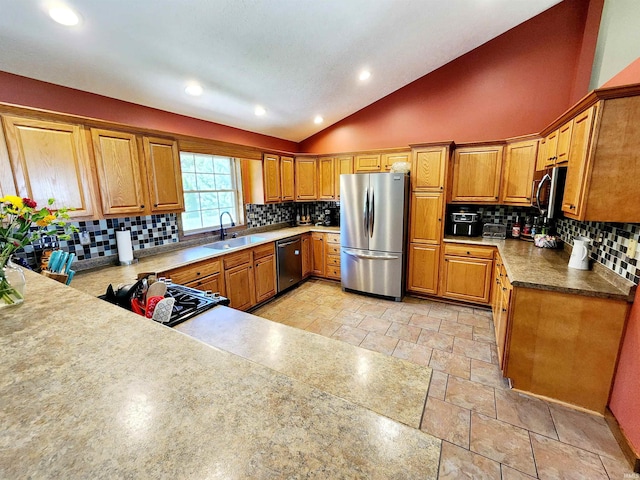 kitchen featuring sink, high vaulted ceiling, stainless steel appliances, and tasteful backsplash