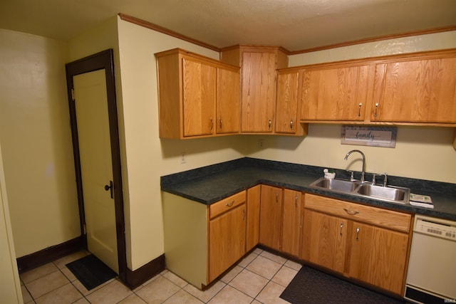 kitchen featuring ornamental molding, sink, light tile patterned floors, a textured ceiling, and dishwasher