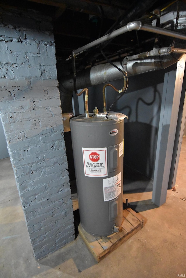 utility room featuring water heater