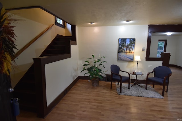 sitting room with hardwood / wood-style floors