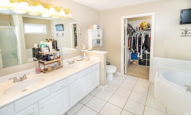 full bathroom with vanity, toilet, tile patterned floors, and plus walk in shower