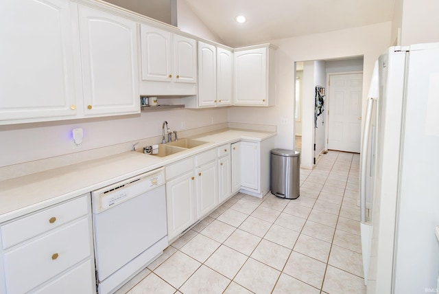 kitchen featuring white appliances, lofted ceiling, and white cabinets