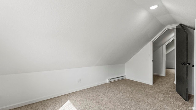 bonus room with light carpet, lofted ceiling, a textured ceiling, and baseboard heating