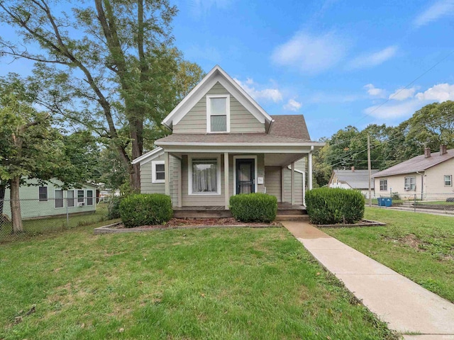 bungalow-style home featuring a porch and a front lawn