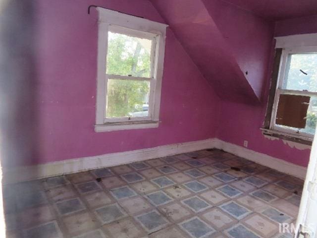 bonus room featuring vaulted ceiling and a wealth of natural light