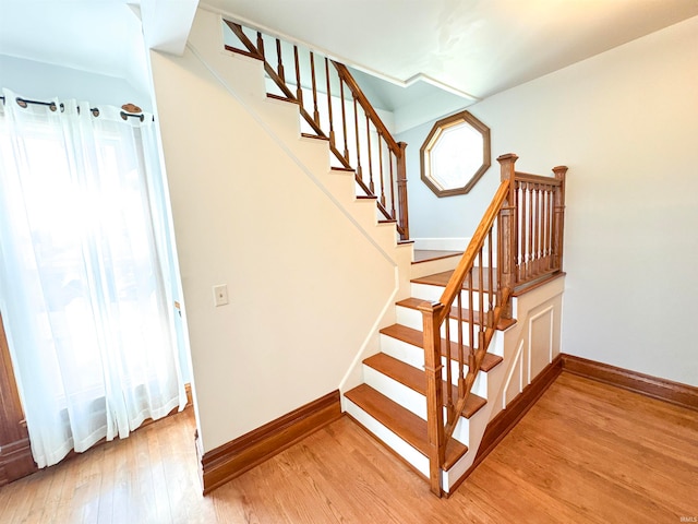 stairway featuring wood-type flooring