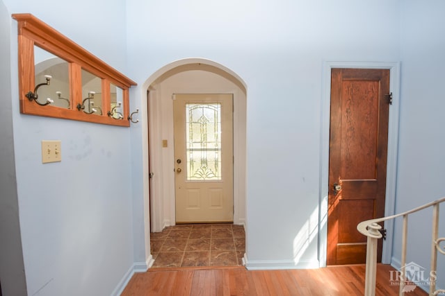 doorway to outside featuring dark hardwood / wood-style flooring