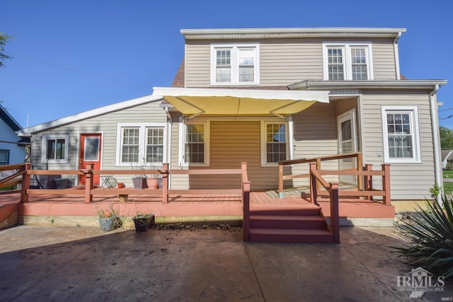 back of house featuring a wooden deck