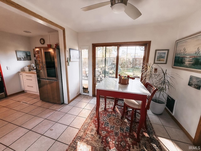 dining area featuring light tile patterned flooring and ceiling fan