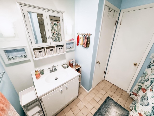 bathroom featuring tile patterned flooring and vanity