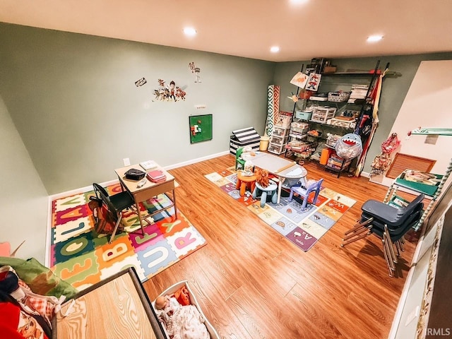 playroom with hardwood / wood-style flooring