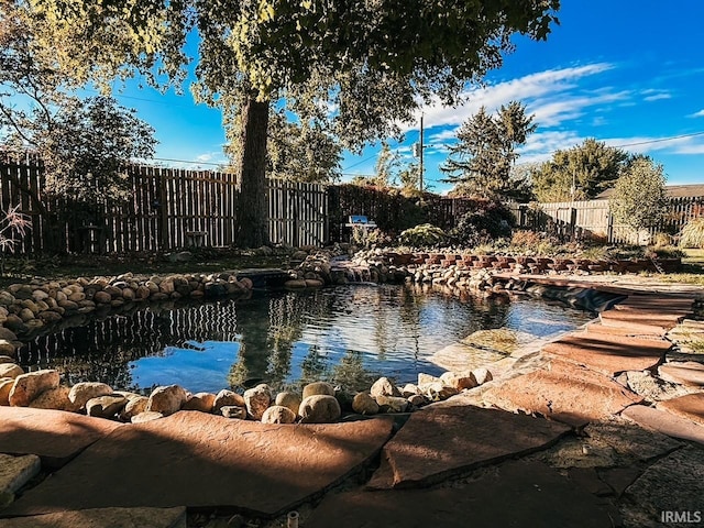 water view featuring a small pond