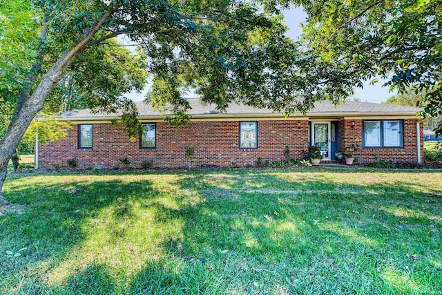 ranch-style home with a front yard