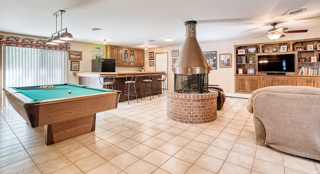 game room with billiards, bar, ceiling fan, and light tile patterned flooring