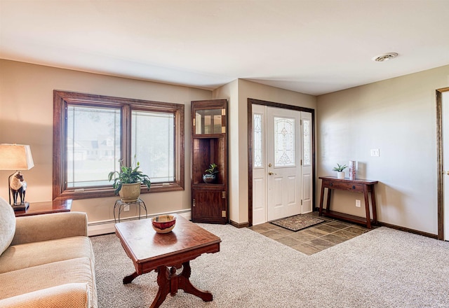 entrance foyer featuring carpet flooring and a baseboard radiator