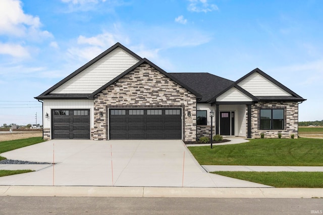 craftsman-style house featuring a front yard and a garage