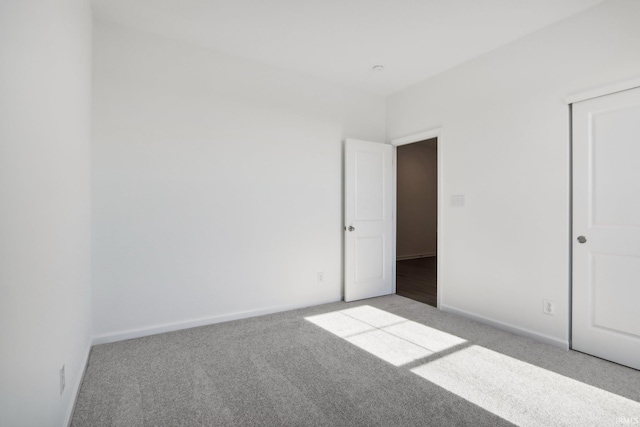 empty room featuring light carpet