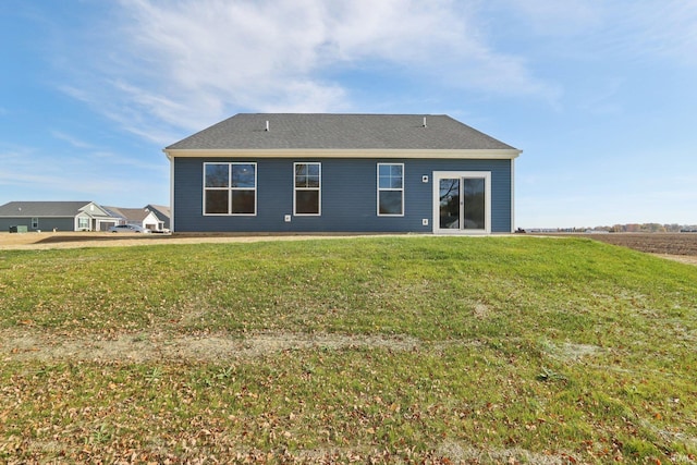 back of house featuring a yard