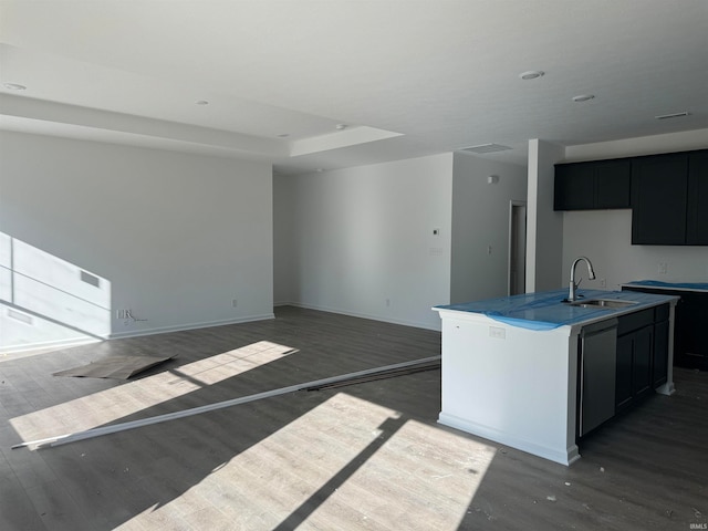 kitchen featuring hardwood / wood-style flooring, dishwasher, sink, and an island with sink