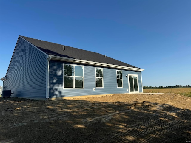 back of house featuring central air condition unit