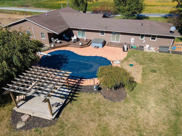 view of pool featuring a yard and a patio area