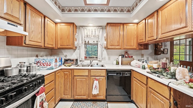 kitchen featuring a healthy amount of sunlight, black dishwasher, sink, and stainless steel gas range