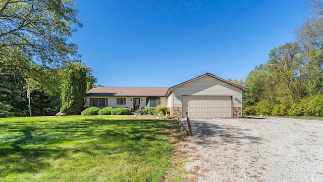 single story home with a front lawn and a garage