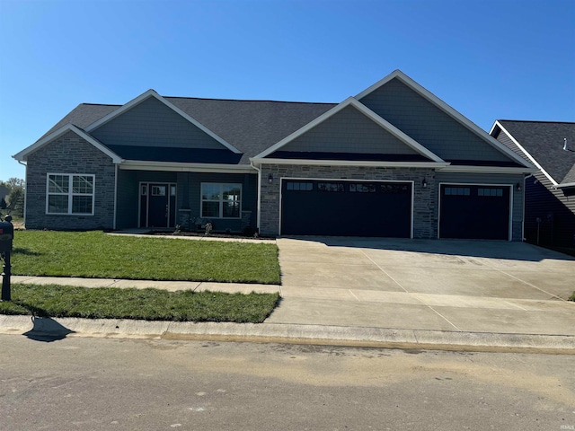 craftsman inspired home with a front yard and a garage