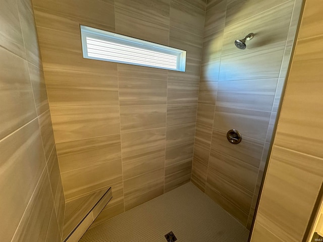 bathroom featuring tiled shower