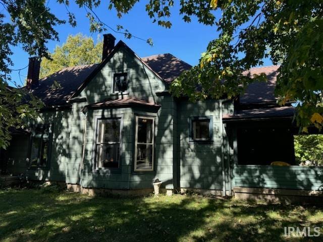 view of side of property with a yard