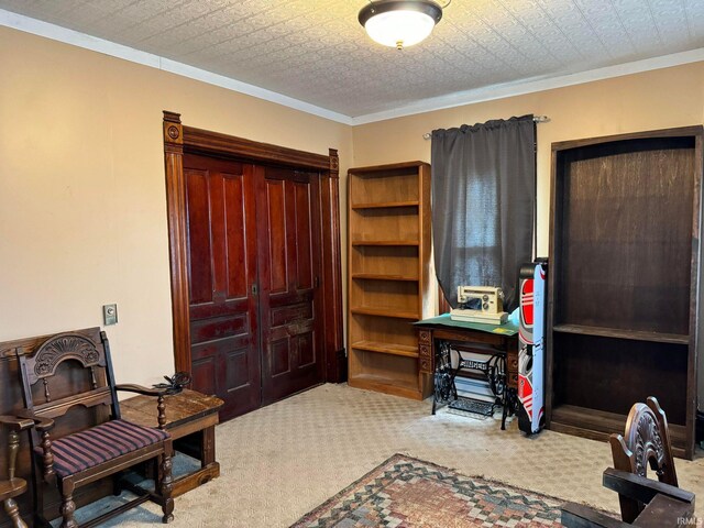 carpeted home office with a textured ceiling and ornamental molding