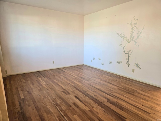 empty room featuring dark hardwood / wood-style flooring