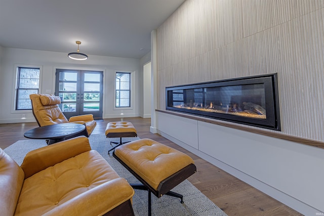 2065 Chadwick Dr, Newburgh, IN 47630 - living area featuring french doors, a glass covered fireplace, and wood finished floors
