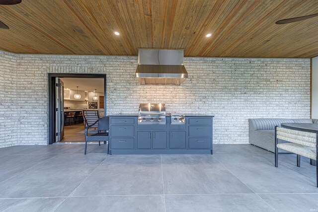 view of patio with an outdoor kitchen, ceiling fan, and a grill