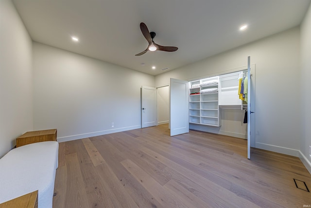 unfurnished bedroom featuring light hardwood / wood-style flooring and ceiling fan