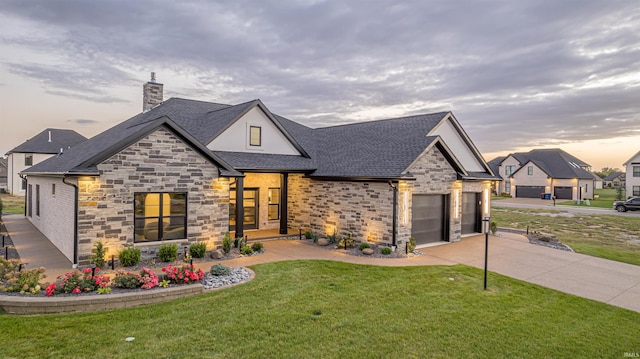 view of front of house featuring a garage and a front yard