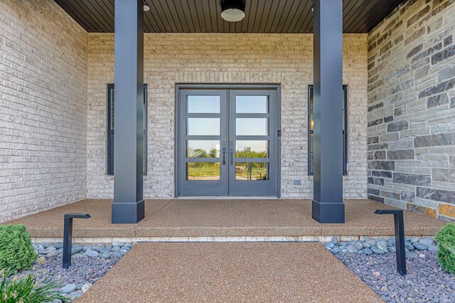 entrance to property with french doors and covered porch