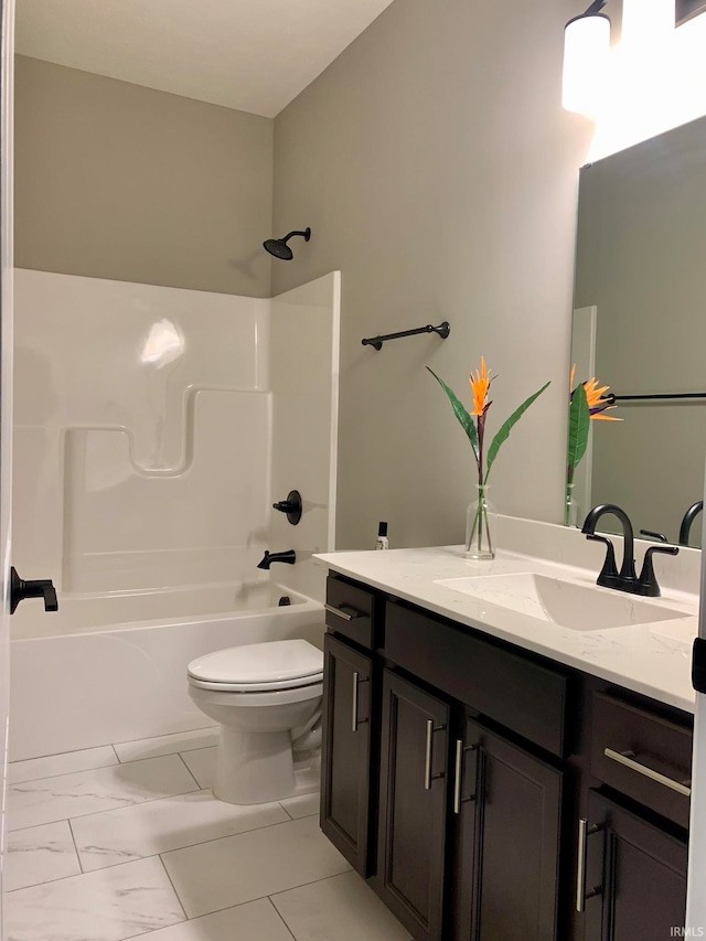 full bathroom with vanity, toilet, and washtub / shower combination