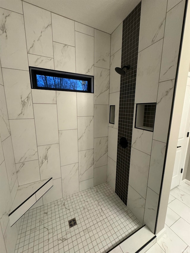 bathroom featuring a tile shower