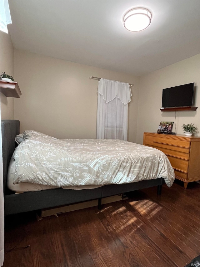 bedroom featuring dark hardwood / wood-style floors