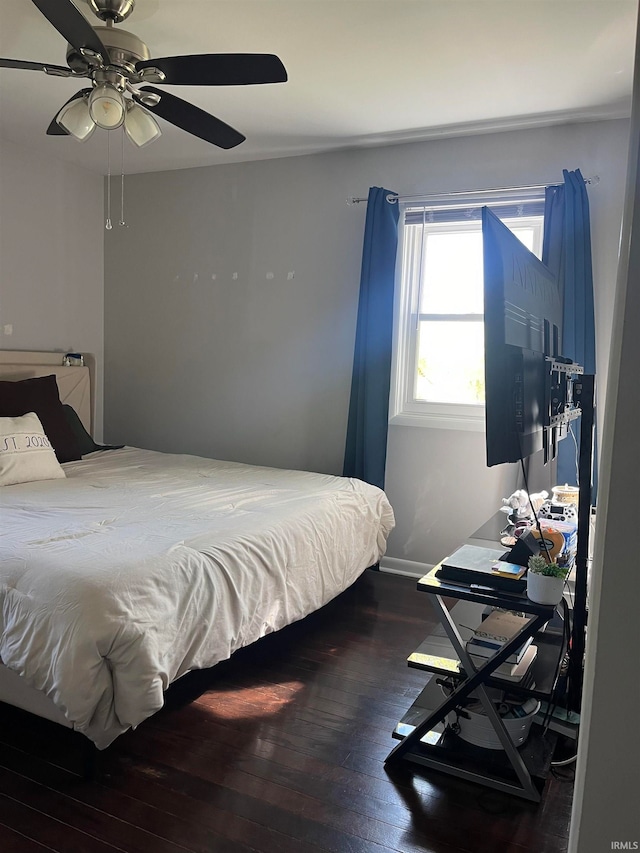 bedroom with ceiling fan and wood-type flooring