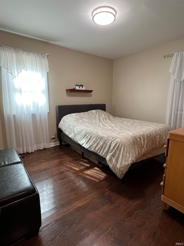 bedroom featuring dark wood-type flooring