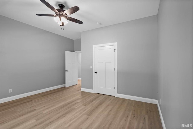 unfurnished room featuring ceiling fan and light hardwood / wood-style floors