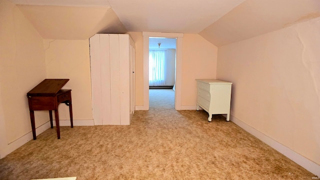 bonus room featuring lofted ceiling and light carpet